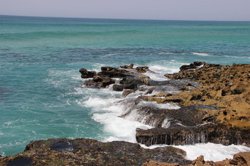 waves crashing on rocks