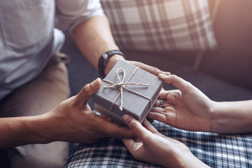 christmas, valentine, holidays gift box concept. Couple surprise gift box together.