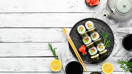Vegetarian sushi with avocado and tomatoes. Sushi Set. Top view. Free space for your text