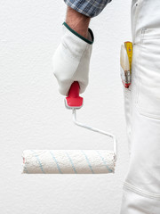House painter worker at work in the construction site. Building.