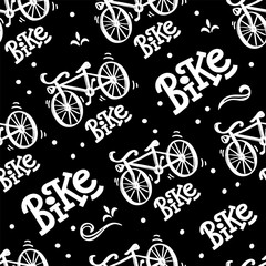 Seamless pattern with bicycle illustration and lettering of word Bike. On an isolated black background. great print for fabric and bedding.
