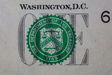 Closeup of front side of 1 dollar bill