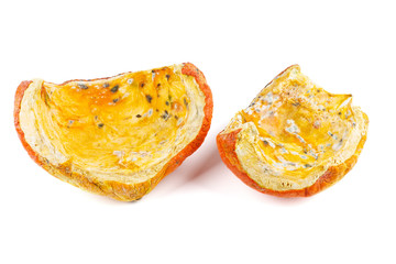 Rotten pumpkin pieces isolated on white background