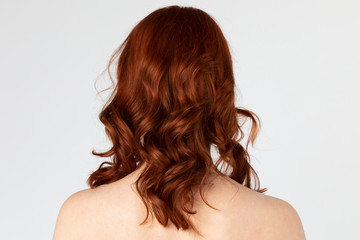 Fototapeta premium Rear view of a red headed woman