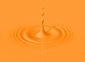Drop of orange milkshake and ripple