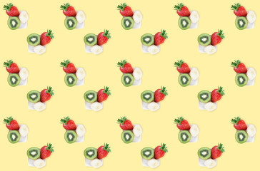 Colorful summer fruit mix pattern of fresh strawberry, kiwi and banana pieces on yellow background. Minimal flat lay food texture.