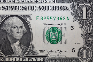 Closeup of front side of 1 dollar bill