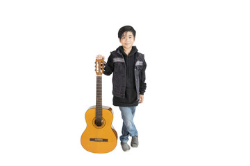 Portrait of a cute Asian boy elementary school student with a guitar. An isolated image with white background.