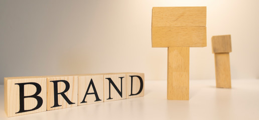 Make your own brand. Brand word with wooden letter cubes.