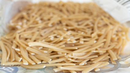 Noodles grains close-up and in the package.