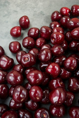 Sweet cherry ( black cherries) with water drops as background