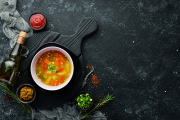 Vegetable soup in a bowl. Healthy food. Top view. Free space for your text.