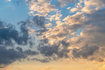 orange sunset sky with lighted clouds