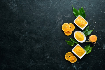 Orange sea salt with aroma of orange. Spa treatments. Top view. Free copy space.