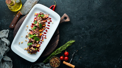 Baked goose liver with apple and cranberry sauce. Top view. Free copy space. © Yaruniv-Studio