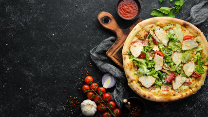 Pizza Caesar. Pizza with chicken, cheese and lettuce. Top view. Free space for your text.