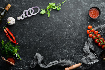 Black banner. Background of cooking, spices and vegetables. Top view. Free space for your text.