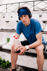 Athlete rests after running sitting on the podium