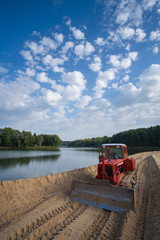 
tractor on the dam construction