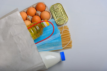 A set of different products for donation. Canned food, eggs, fruits and vegetables on a white background
