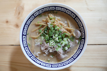 Ramen Japanese noodle soup food with noodle and pork on wooden table