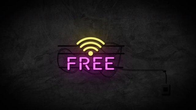 Free wifi neon sign on stone wall background. Business service and technology concept.