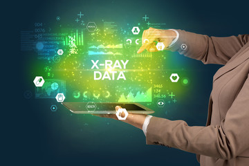 Close-up of a touchscreen with X-RAY DATA inscription, medical concept