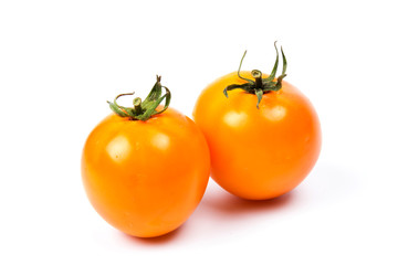 Yellow fresh tomatoes isolated on white background in close-up