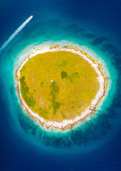 Stunning aerial photo of round island in the mediterranean sea. Location place Pula, Croatia, Europe.