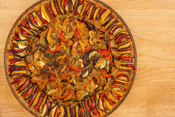 French cuisine ratatouille vegetable dish flatlay on wood