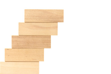 Row of wooden block tower game children isolated on white background