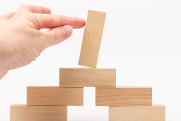 Domino effect, row of wood domino on white background