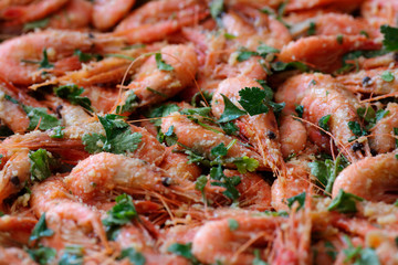 Fresh boiled prawns with coriander. A delicious dish of seafood.
