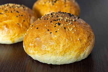 Group of three whole homemade burger bun