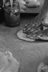 hands of the woman baking a pie