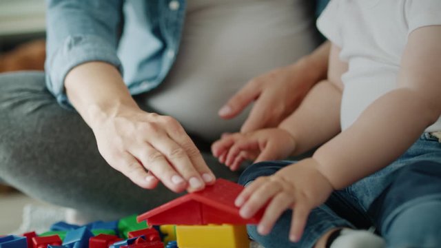 Video of mother and her toddler playing with toy blocks. Shot with RED helium camera in 8K 