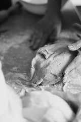 close up of a hand of a man baking