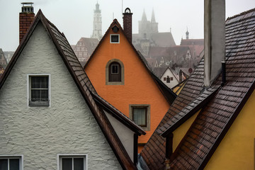 View from town wall of facades and roofs of medieval old town Rothenburg ob der Tauber, Bavaria,...