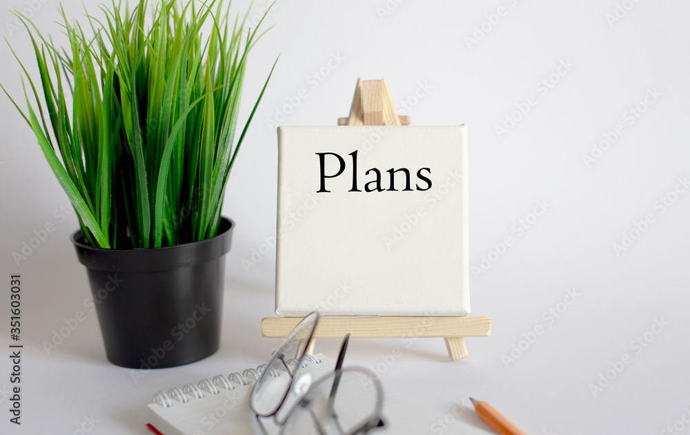 Poster plans .business model - concept of text at canvas with pencil, notebook on the table