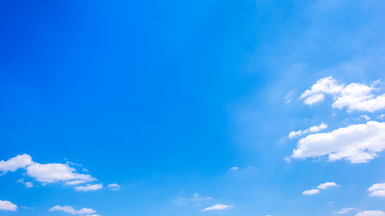 Beautiful blue sky with fluffy clouds as a background