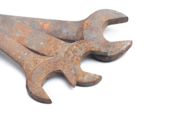Old rusty wrench isolated on white background. 