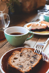 homemade pie with raisins and nuts and a cup of coffee in the cafebanana bread