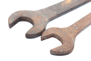 Old rusty wrench isolated on white background. 