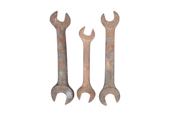 Old rusty wrench isolated on white background. 