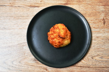 baked circle sweet bread with honey on dish