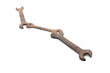 Old rusty wrench isolated on white background. 