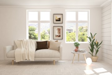 White living room with sofa and summer landscape in window. Scandinavian interior design. 3D illustration