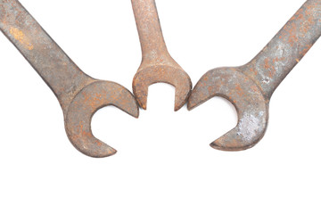 Old rusty wrench isolated on white background. 