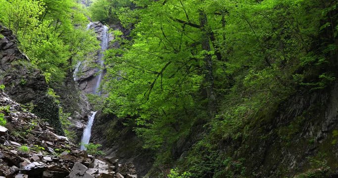 Three-stage waterfall in the spring in the mountains