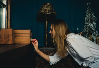 the girl turns on the music on the player